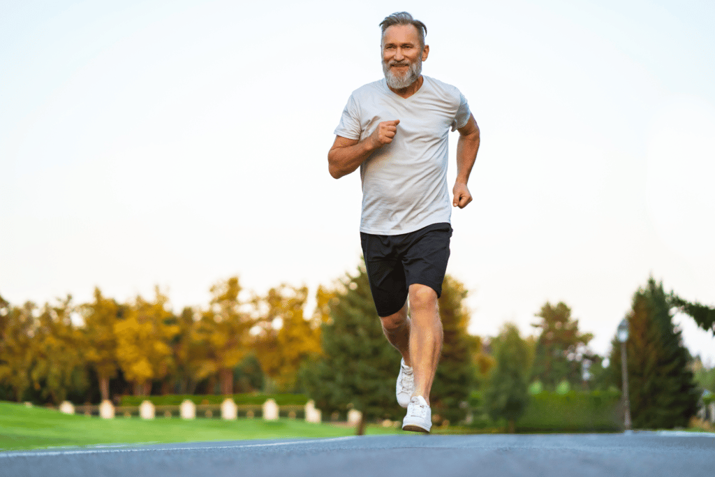 Man running on the road near a park - are runners allowed to run on the road?